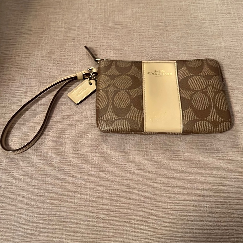 Coach tan wristlet with zipper closure 6” x 4”